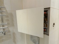 Inspection hatch under the tiles - hidden access to the communications