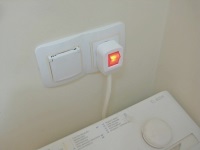 Prise pour machine à laver dans la salle de bains