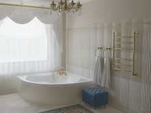 Baltas vonios kambarys su mėlynais priedais.