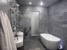 Gray bathroom with white fixtures