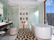 Oval bathtub in a large bathroom without a toilet
