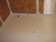 Floor waterproofing in the bathroom of a wooden house