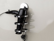 Estilos de soportes de secador de pelo para el baño