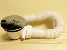 Sistema de drenaje automático del plato de ducha por sifón