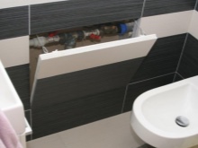 Sanitary hatch invisible in the bathroom and its installation