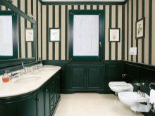 Bright floor cabinet with built-in sinks in a fusion bathroom