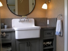 Floor cabinet on legs with rustic bathroom sink