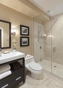 Beige badrum med svarta möbler