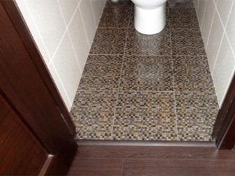 Wooden threshold in the bathroom