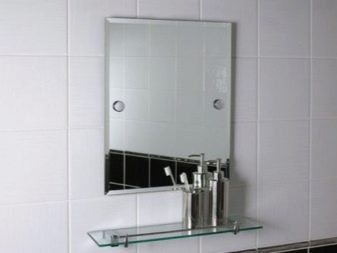 Installing a mirror with a shelf in the bathroom with screws