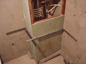 The corner box in the bathroom with his hands