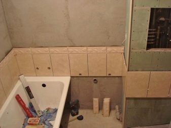 The box in the corner of the bathroom with his hands