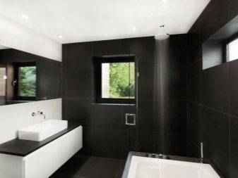 Hvid og sort vægskab med håndvask til et high-tech badeværelse