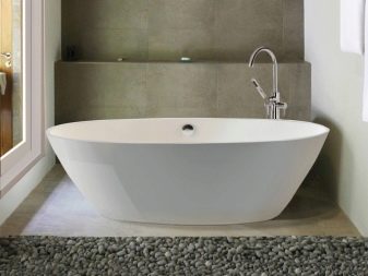 A oval white bathtub for a small bathroom