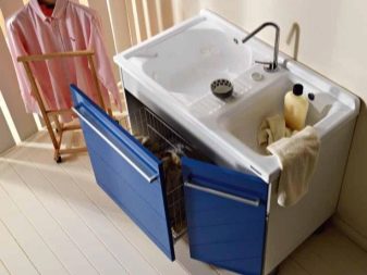 Bathroom cabinet with washbasin and built-in laundry basket