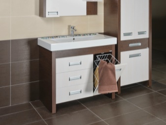 MDF cabinet in wood imitation with white drawers and built-in laundry basket