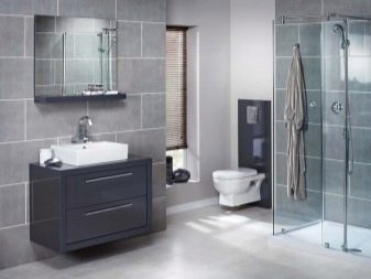 Suspended cabinet in a dark color with a white overhead bathroom sink