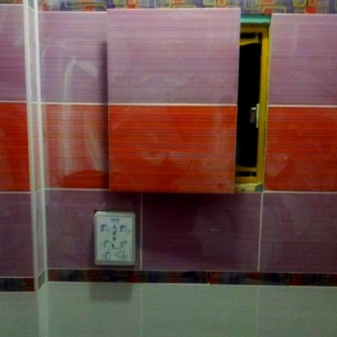 Facing of the invisible sanitary hatch in the bathroom 