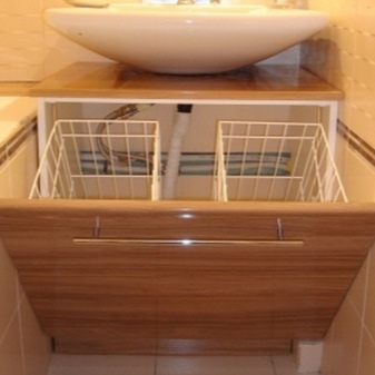 Cabinet with sink and laundry basket