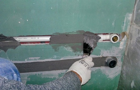 Dölja rören i väggen