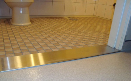 No threshold between the bathroom and the hallway