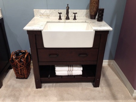 A cabinet with a built-in sink for a small bathroom