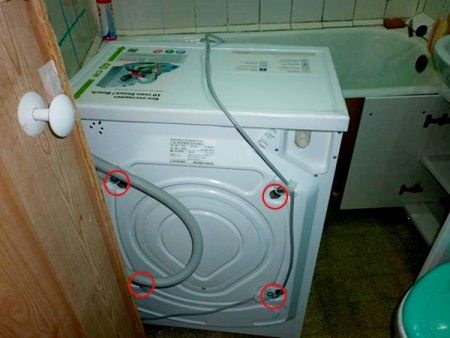 Location of transport bolts on the washing machine