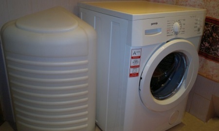 Dacha washing machine with a water tank