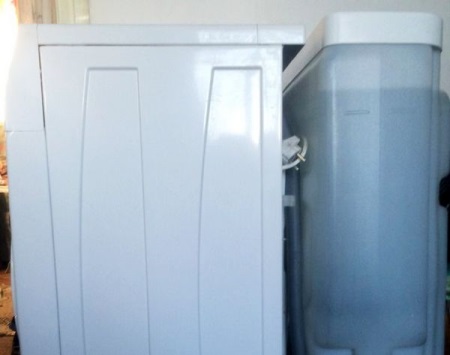 Dacha washing machine with water tank